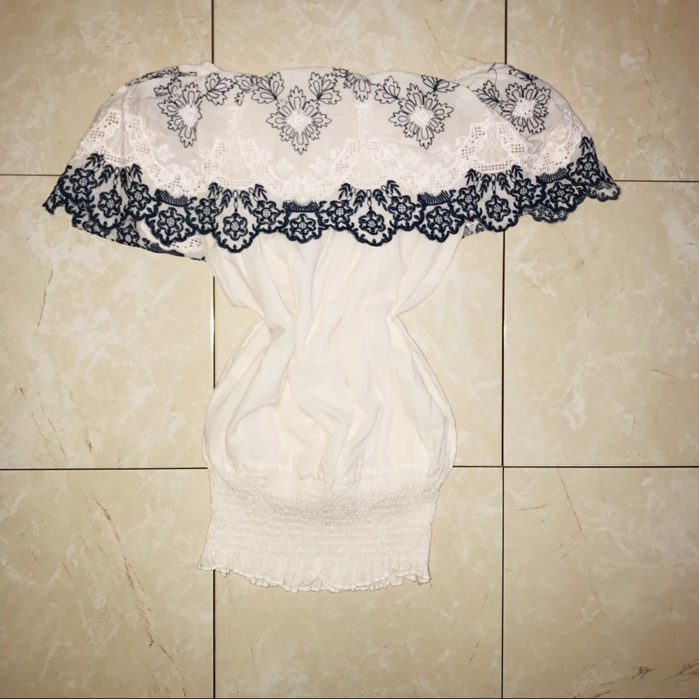 White blouse with blue and white lace